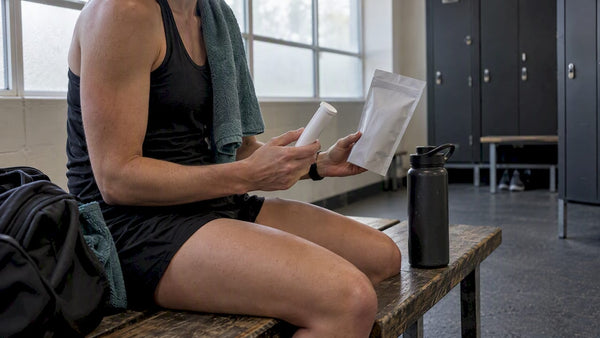 Athlete comparing hydration tablets and powder