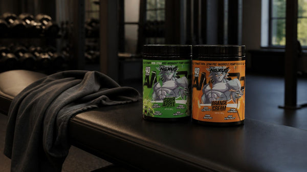 Two Nexus AMP3D 2.0 tubs in Sour Apple and Orange Cream on a bench in a dim evening gym