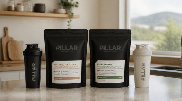 Pillar Performance Whey Protein Isolate and Plant Protein pouches side by side on a kitchen bench with two shakers