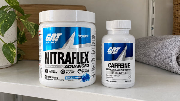 GAT Nitraflex Advanced Blue Raspberry tub and Essentials Caffeine bottle on a shelf