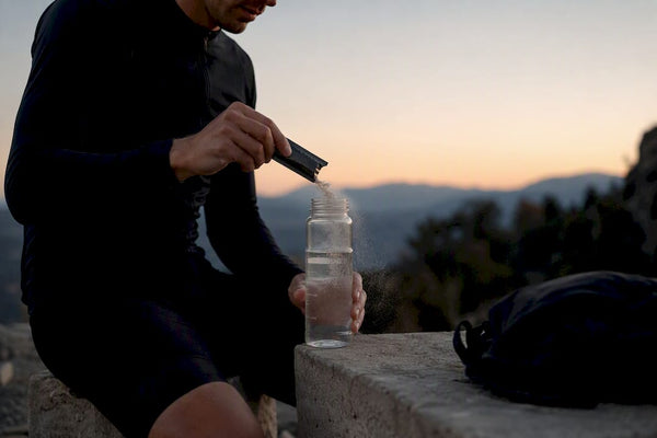 Cyclist mixing electrolyte hydration drink