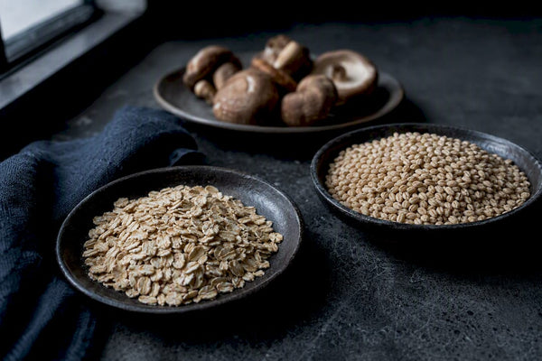 Oats barley and mushrooms representing beta glucan sources