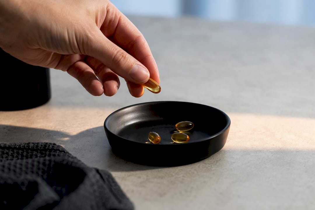 Anonymous omega-3 capsules being measured