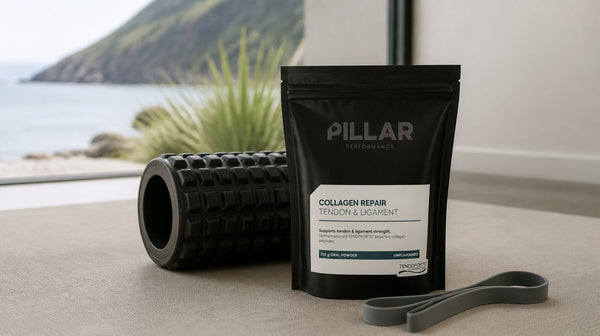 Pillar Collagen Repair tub beside a foam roller and a resistance band on a physio mat