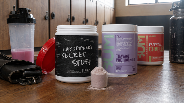 Range of CBUM Thavage pre-workout tubs in different flavours