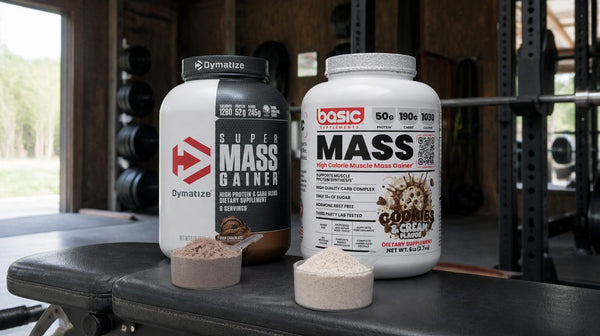 Dymatize Super Mass Gainer and Basic Mass Gainer tubs on a bench with a bowl of each powder in front