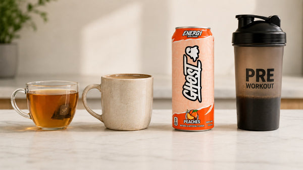 Tea, coffee, a Ghost Energy can and a pre-workout shaker lined up, comparing caffeine sources