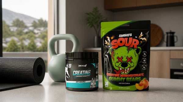 Creatine tub and a creatine gummy pouch on a kitchen bench beside a yoga mat and a light kettlebell