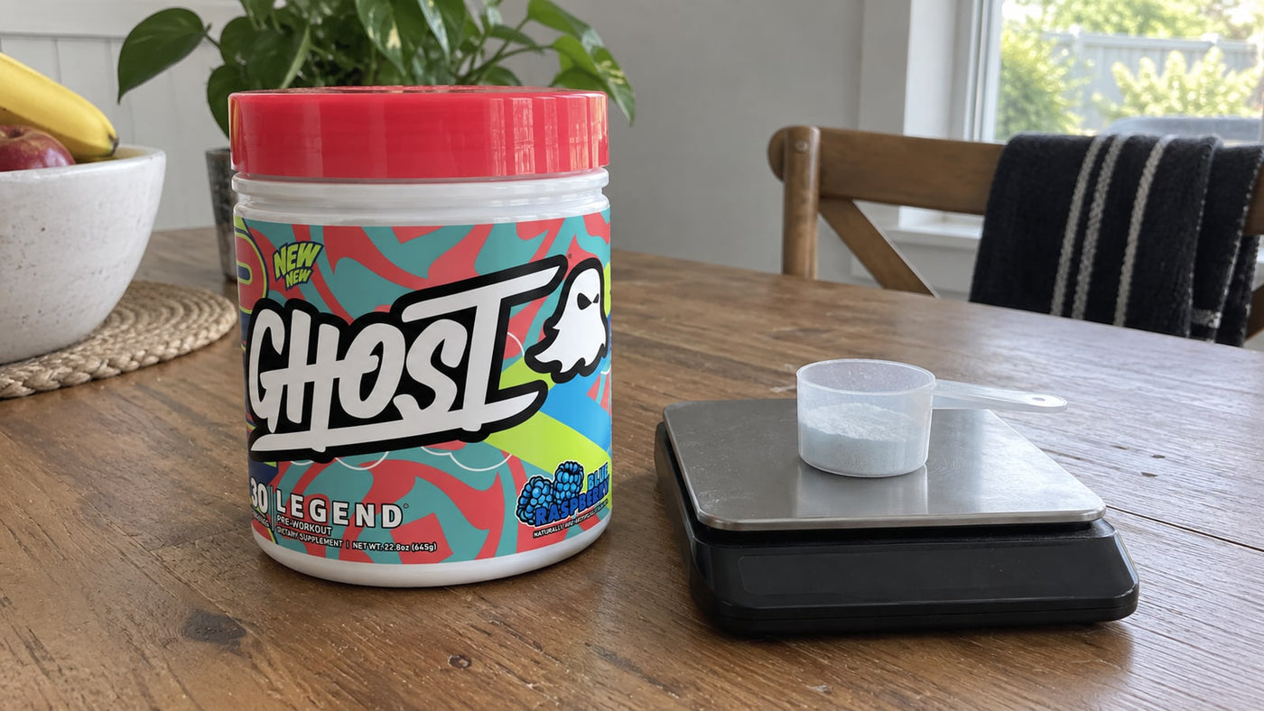GHOST Legend Blue Raspberry beside a small powder scoop and kitchen scale.