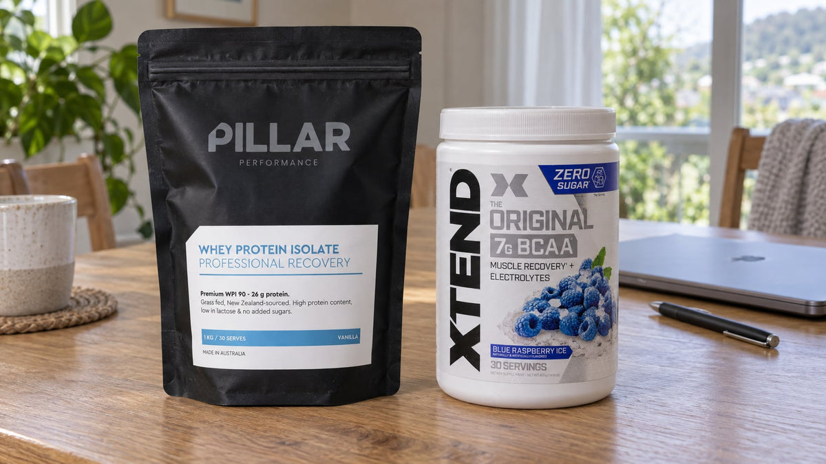 Pillar Performance Vanilla Whey Protein Isolate and Xtend Blue Raspberry Ice on a dining table.