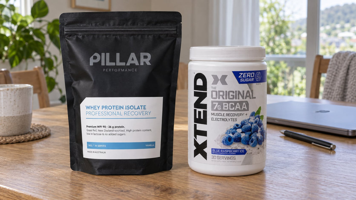 Pillar Performance Vanilla Whey Protein Isolate and Xtend Blue Raspberry Ice on a dining table.