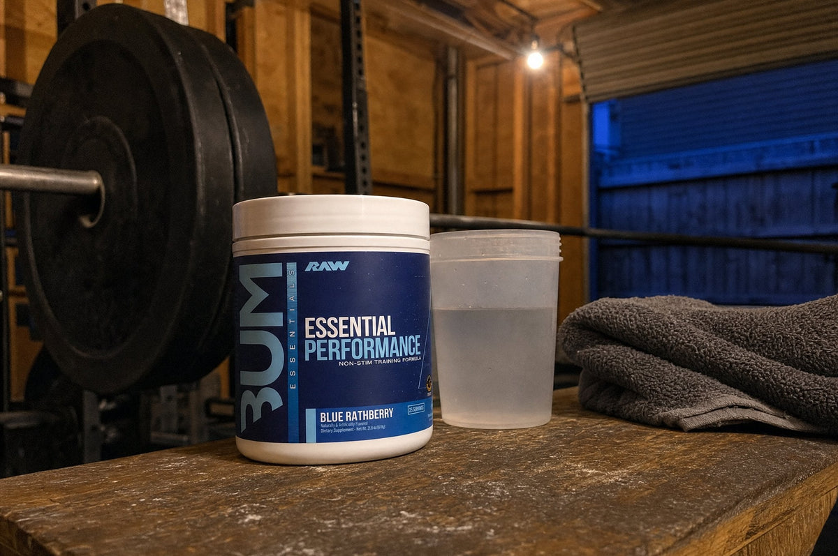 RAW Essential Performance Blue Rathberry tub on a wooden bench in a home garage gym in the evening