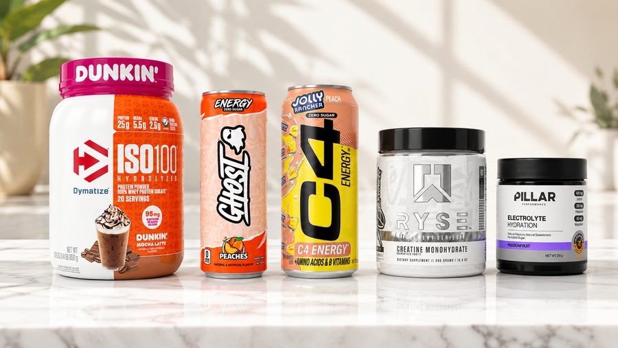 Dymatize, GHOST, C4, RYSE and Pillar supplements on a marble counter